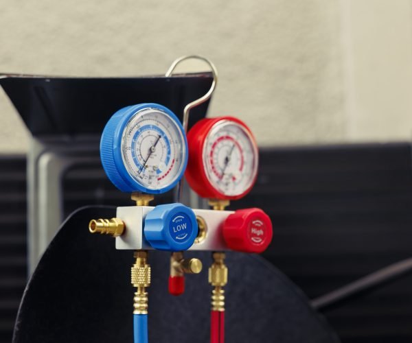 Close up of broken manometers used for checking hvac system freon pressure, in need of servicing. Set of barometer high or low refrigerant levels benchmarking air conditioner component